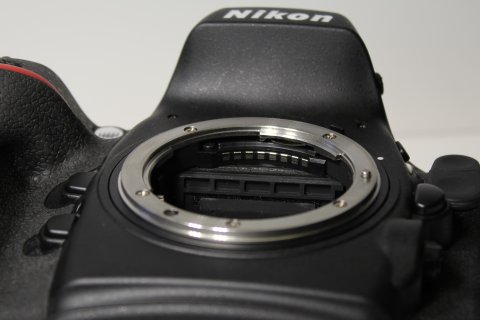 Five shallow engagement depressions beneath the Nikon reflex mirror